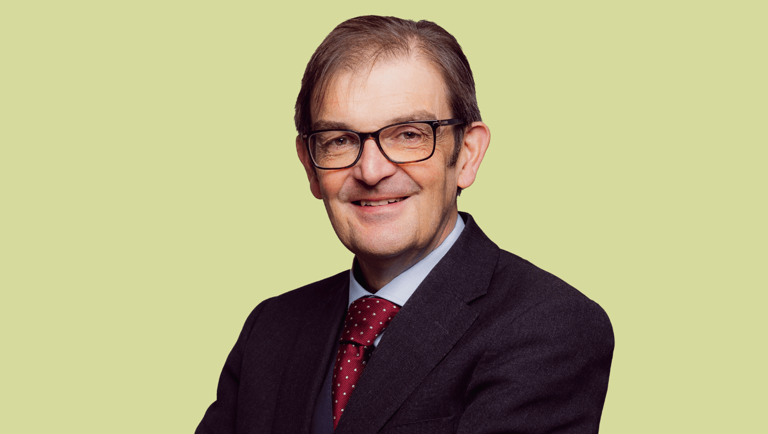 An image of Martin Landray on a bright green background