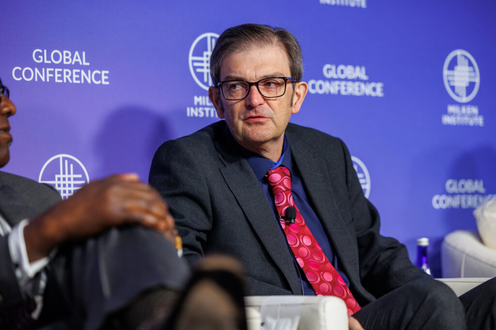 An image of Martin Landray on stage at Milken Institute 2024 Global Conference